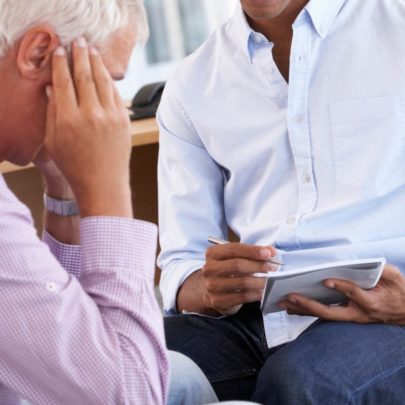 Adult man thinking during psychiatry session